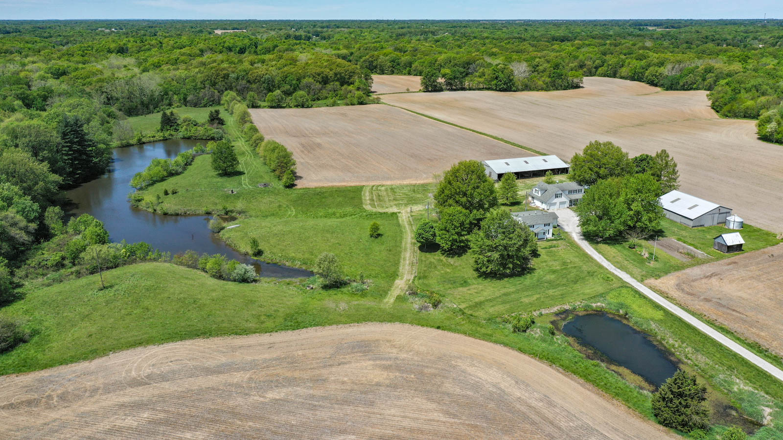 40+/- acres, 2 homes, ponds, and more!